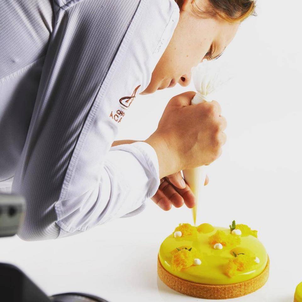 Chef Naomi puts the finishing touches on a tart