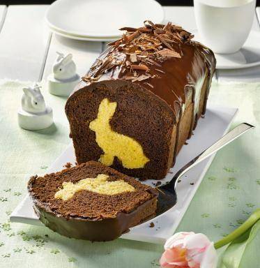Easter bunny cake with chocolate shavings and a contrasted Easter bunny in the dough - Easter decorations