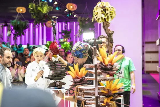 Julie Sharp describes the action at WCM while Igor Zartiskyi places his sculpture on a stand